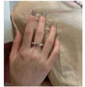 Detailed close-up of handmade S925 silver beaded ring with Dalmatian jasper stone beads