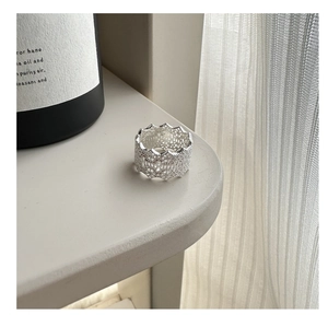 Detailed macro view of an intricate S925 silver lace ring with geometric hollow patterns