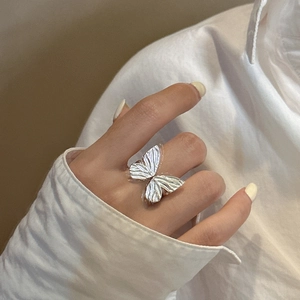 Textured S925 sterling silver butterfly ribbon open ring worn on finger for women
