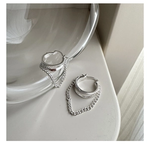 Detail shot of S925 sterling silver tassel earrings featuring hallmark engraving