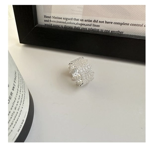 Detailed shot of S925 sterling silver lace mesh ring with wavy edges on minimalist set