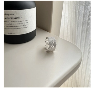Detailed close-up of S925 sterling silver ring with intricate lace hollow-out texture