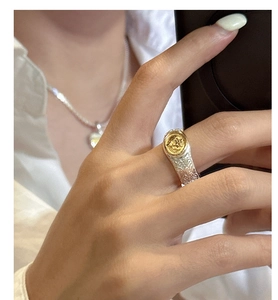 Close-up of S925 silver tree of life signet ring with gold accent and vine relief detail