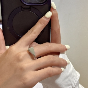 Mirror selfie showing the minimalist S925 sterling silver heart ring on a finger