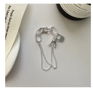 Detail of S925 sterling silver chain bracelet featuring a textured oval link and clothes peg charm