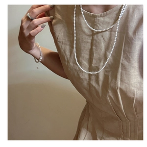 Elegant 925 sterling silver pearl necklace layered with a matching bracelet and ring set