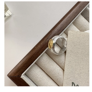Detail of S925 silver tree of life ring with vintage gold relief and engraved textures