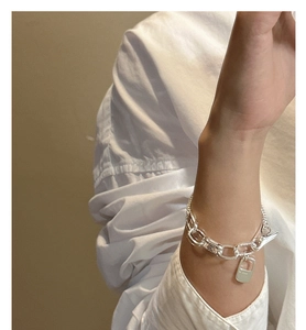 Detail of S925 sterling silver chain bracelet featuring a secure OT toggle clasp and tag