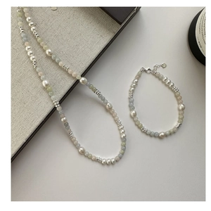 Detail of S925 silver necklace and bracelet set with pearls and colorful beads