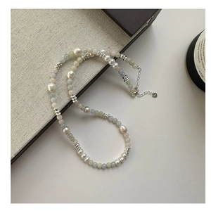 Detail of S925 sterling silver necklace with baroque pearls and colorful gemstone beads