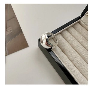 Polished silver wide open ring with mirror finish texture and minimalist sleek style