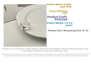 Detailed view of polished S925 sterling silver double-layer ring on a ceramic tray