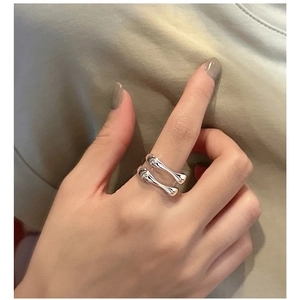 Close-up of S925 sterling silver double-layered open ring with sleek minimalist design