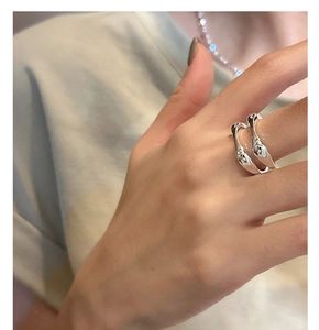 Close-up of S925 sterling silver minimalist double-layer irregular wavy ring for women