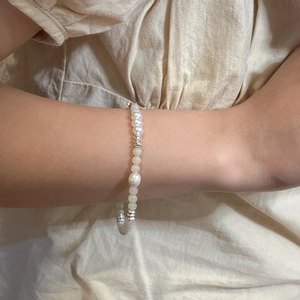 Handmade S925 silver bracelet with white pearls and colorful dopamine beads on a model