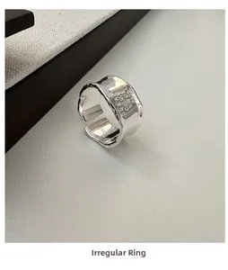 Detailed macro view of S925 silver wide ring with Dream Come True engraving and wave edge
