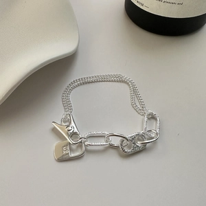 Minimalist S925 sterling silver bracelet with double chains and geometric rings