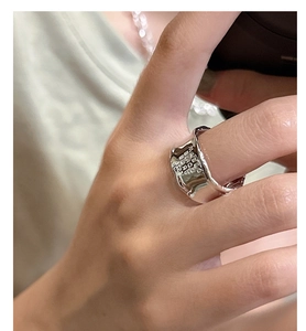 Macro shot of S925 silver wide ring featuring 'MAKING MOMENTS' engraved texture