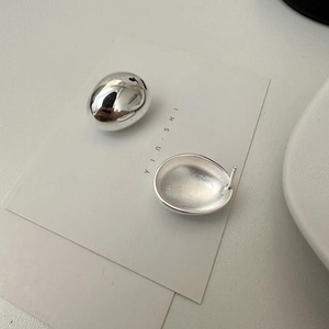 Minimalist S925 sterling silver oval stud earrings with polished finish and matte interior