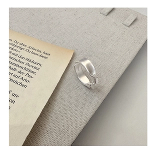 Detail view of S925 sterling silver matte knotted ring with inner engraving and texture