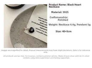Macro detail of S925 sterling silver black heart pendant with 40+5cm polished chain