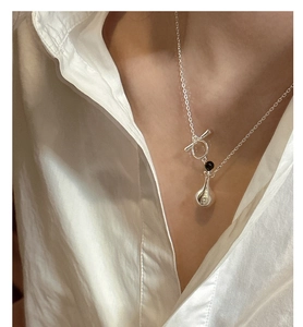 Close-up of S925 sterling silver perfume bottle necklace with toggle clasp and teardrop charm