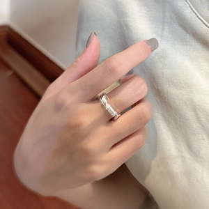 Minimalist S925 sterling silver knotted ring featuring a geometric matte finish design