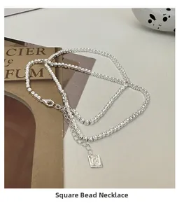 Detail of S925 sterling silver square bead necklace with lobster clasp and extension chain