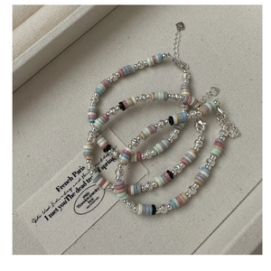 Detailed close-up of S925 sterling silver colorful beaded bracelets with heart charms