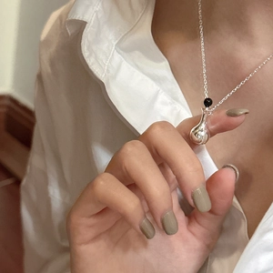 Minimalist S925 sterling silver perfume bottle pendant necklace shown on a model