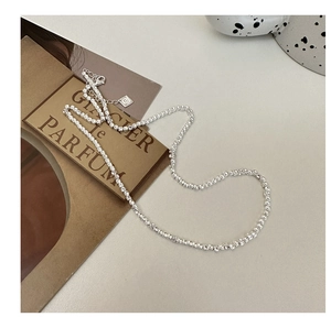 Close-up of S925 sterling silver square link chain with adjustable lobster clasp and tag
