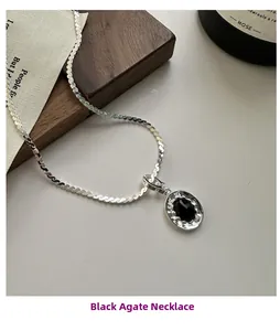 Detailed macro view of S925 silver necklace with black agate in lava texture frame
