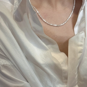 S925 sterling silver square stone tennis necklace worn on a white silk shirt