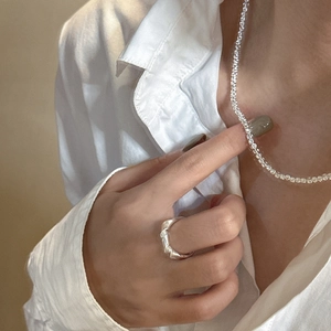 Elegant S925 sterling silver stone necklace and minimalist twisted ring on a model