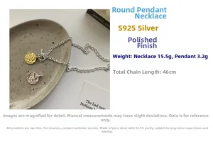 Macro view of hammered S925 sterling silver round pendant necklace with bicolor details