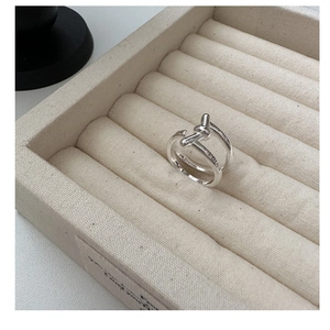 Detail of S925 sterling silver double layer knot ring with Korea engraved on the polished band