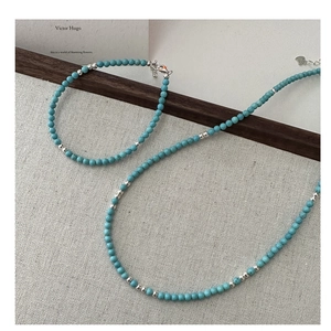Detail of s925 silver turquoise bead bracelet and necklace with elegant lobster clasp