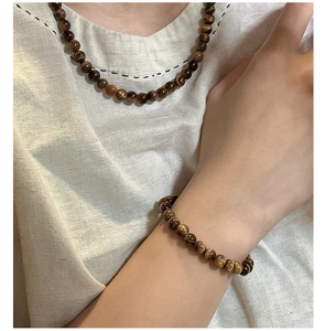 Tiger eye beaded necklace and bracelet set featuring natural brown gemstones with cat-eye effect