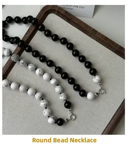 Detail view of S925 silver beaded necklaces with black agate and white turquoise beads