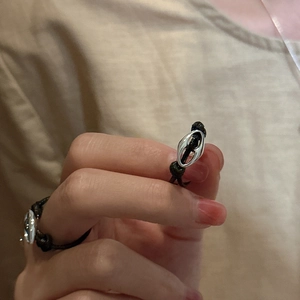 Minimalist S925 sterling silver pig nose buckle ring with black woven rope design