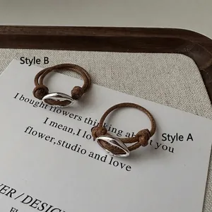 Minimalist S925 sterling silver pig nose ring with brown braided cord design, Style A and B