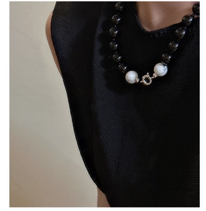 Detail of S925 sterling silver beaded necklace with black agate and white marble beads
