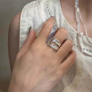 Minimalist double layer S925 sterling silver ring worn on model with elegant jewelry