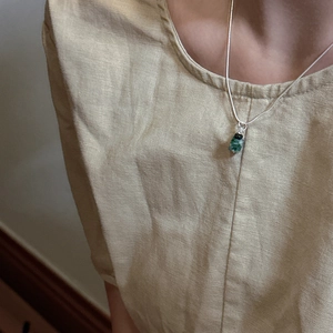 Minimalist S925 sterling silver bow snake chain with green stone pendant on model