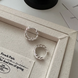 Elegant S925 sterling silver twisted croissant hoop earrings displayed in a gift box