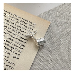 Detailed close-up of an openable S925 sterling silver cylinder pendant with vintage engraving