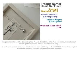 Detailed view of S925 sterling silver heart necklace with beaded chain on jewelry box