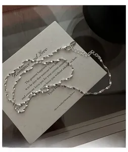 Macro shot of S925 sterling silver water ripple chain necklace with adjustable lobster clasp