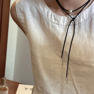Minimalist S925 silver beaded cord necklace worn as a stylish double-layer choker