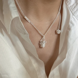 S925 sterling silver necklace with engraved barrel pendant and crown side charm detail